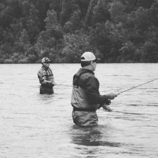 Two brothers fly fishing the Kenai River with Corsetti's Guide Service.