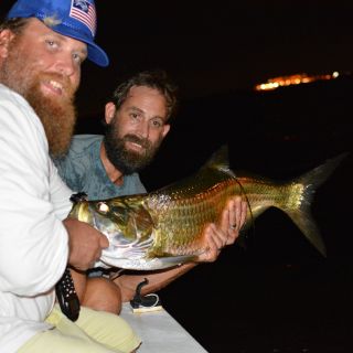 My good friend Adam with a nice mid sized tarpon we sight fished on a recent night trip around Tampa Bay.