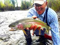 SCO guide Pete Dabaun admires a Wood River rainbow. Randy Ashton photo. 